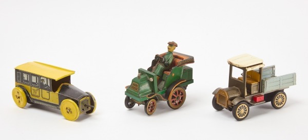 Three Tin Truck Toys and Three Wind-Up Toys