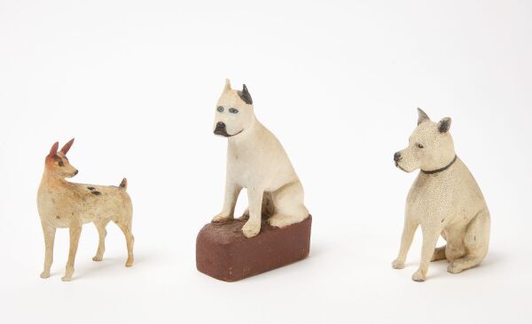 Three Folk Art Carved Dogs