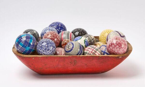 Red Trencher with Collection of Carpet Balls
