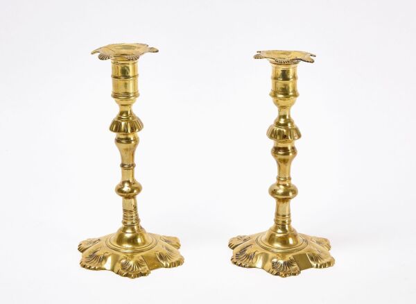 Two closely matched Queen Anne Candlesticks